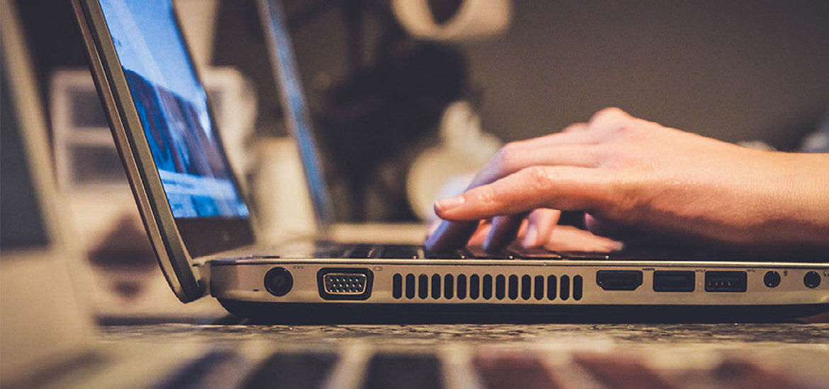 close-up-typing-on-laptop